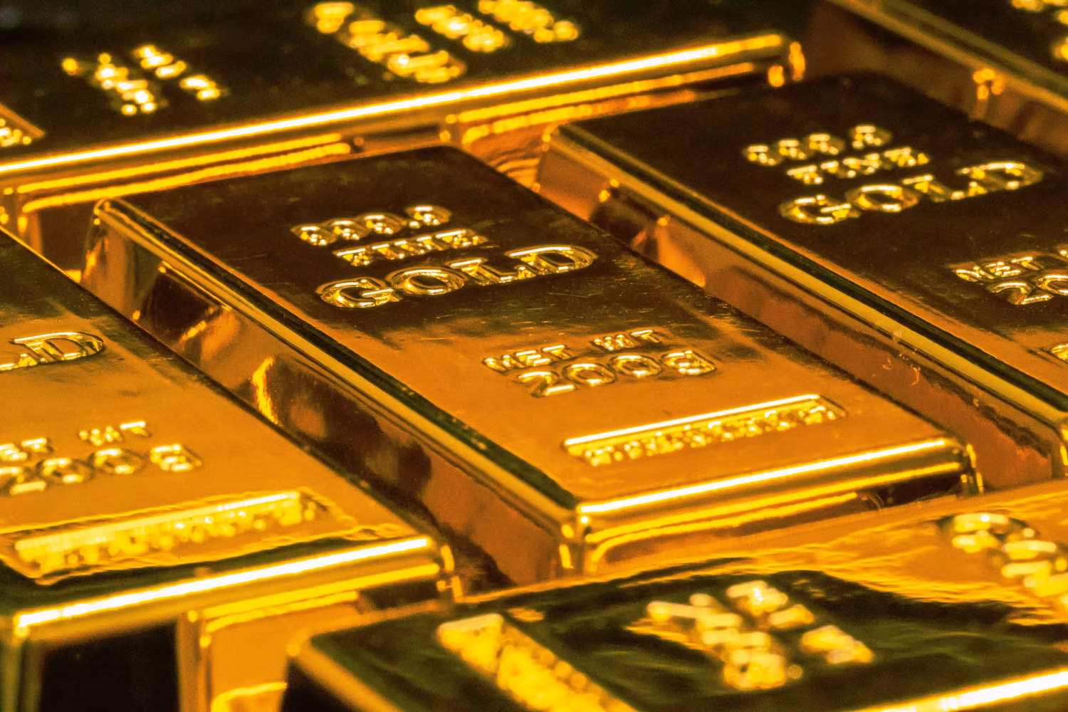 Close-up of stacked gold bars. (Jingming Pan/Unsplash)